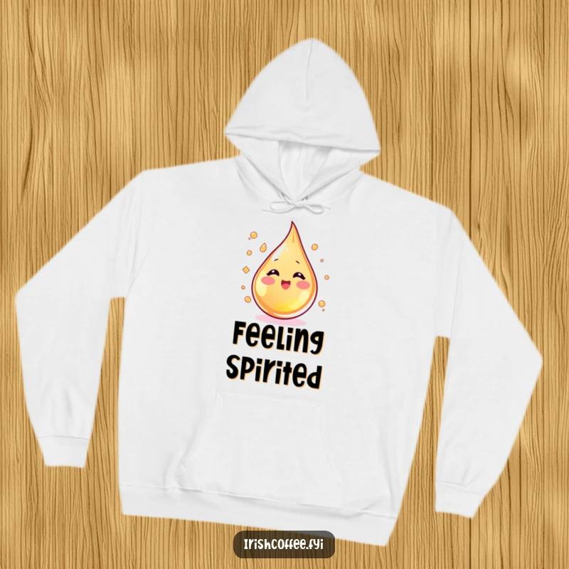 Funny blushing whiskey droplet swirling with excitement on a cozy hoodie, offering warm and spirited comfort.